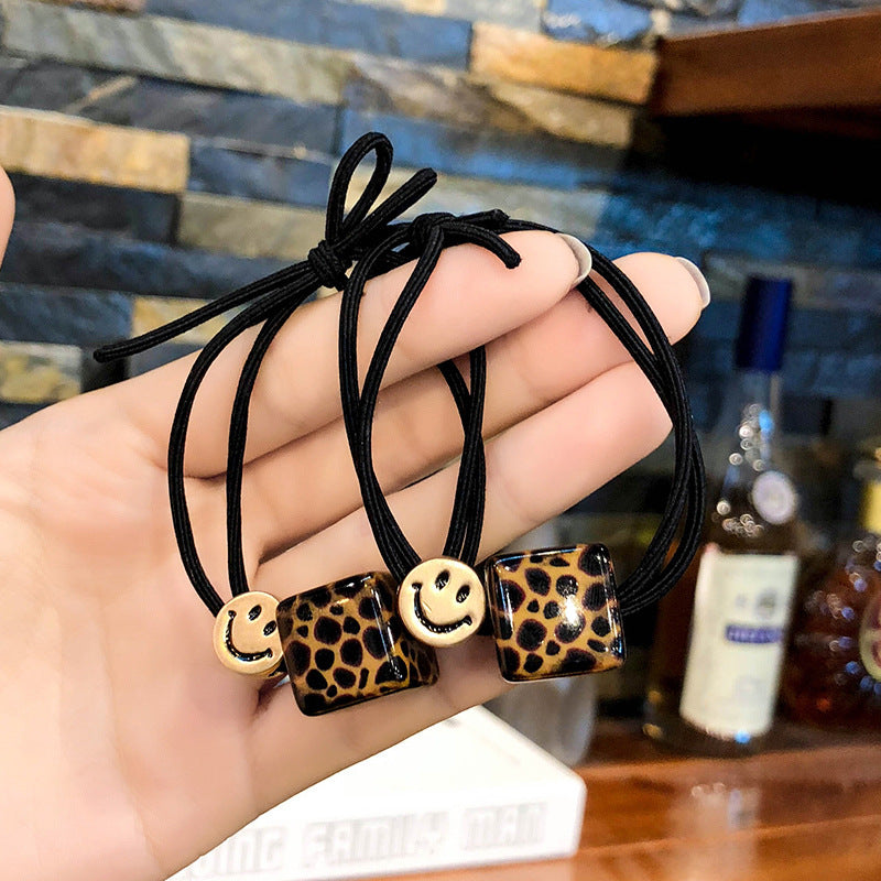 Smiley Face Hair Tie with Leopard Print Acrylic Cube